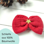 rote Haarschleife mit goldenem Stern