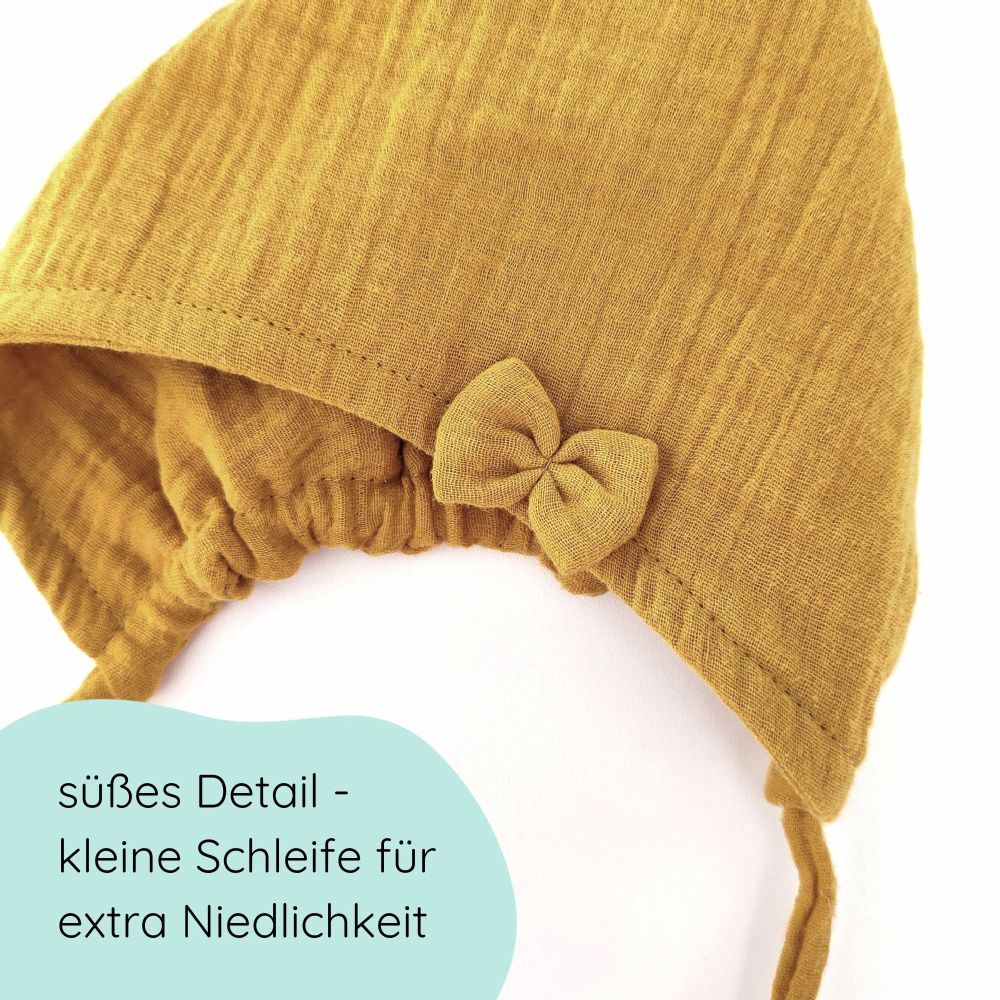 Detailfotof Pixiemütze aus Musselin – Babymütze mit Bindebändern & Schleife in senfgelb