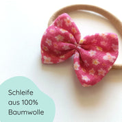 kleine Haarschleife für Babys aus Musselin mit dezentem Blumenmuster Detailbild