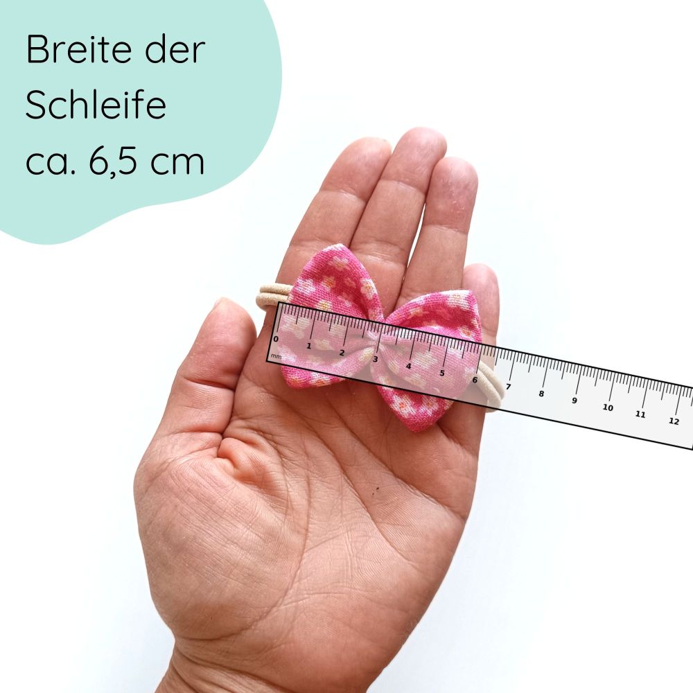 kleine Haarschleife für Babys aus Musselin mit dezentem Blumenmuster Detailbild