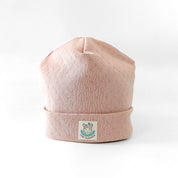 Beanie Mütze für Babys und Kleinkinder in nude aus Baumwolle mit feinem Lochmuster