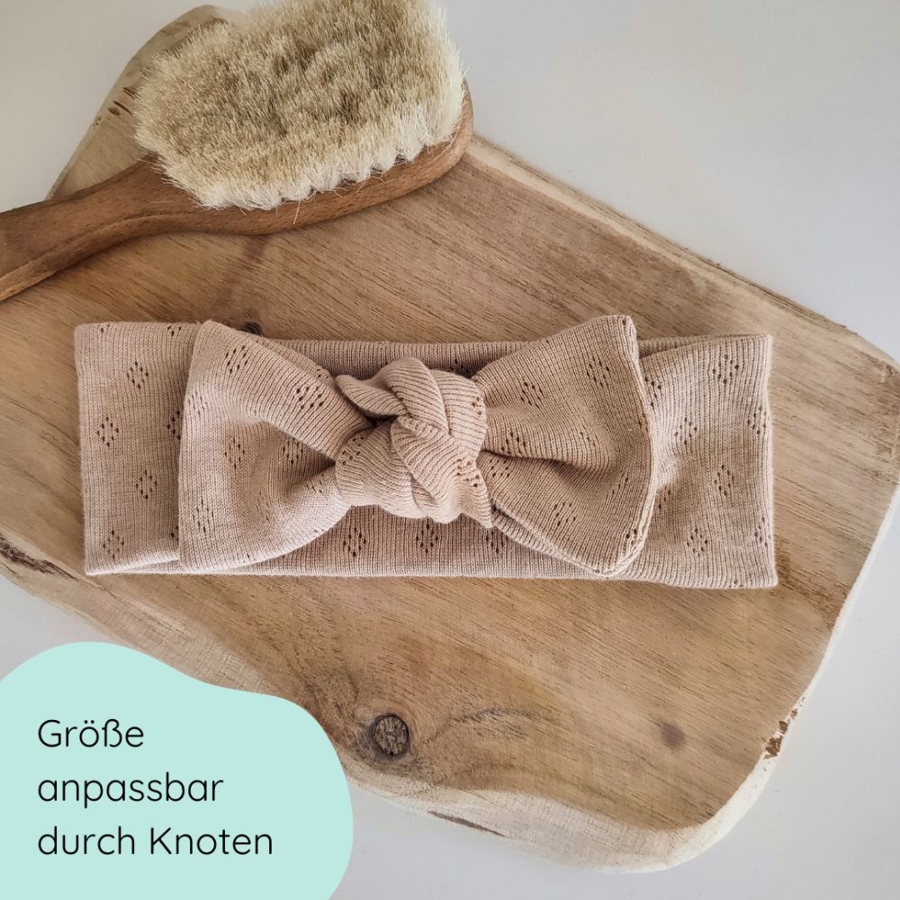 Detailbild Stirnband mit Schleife für Babys in beige