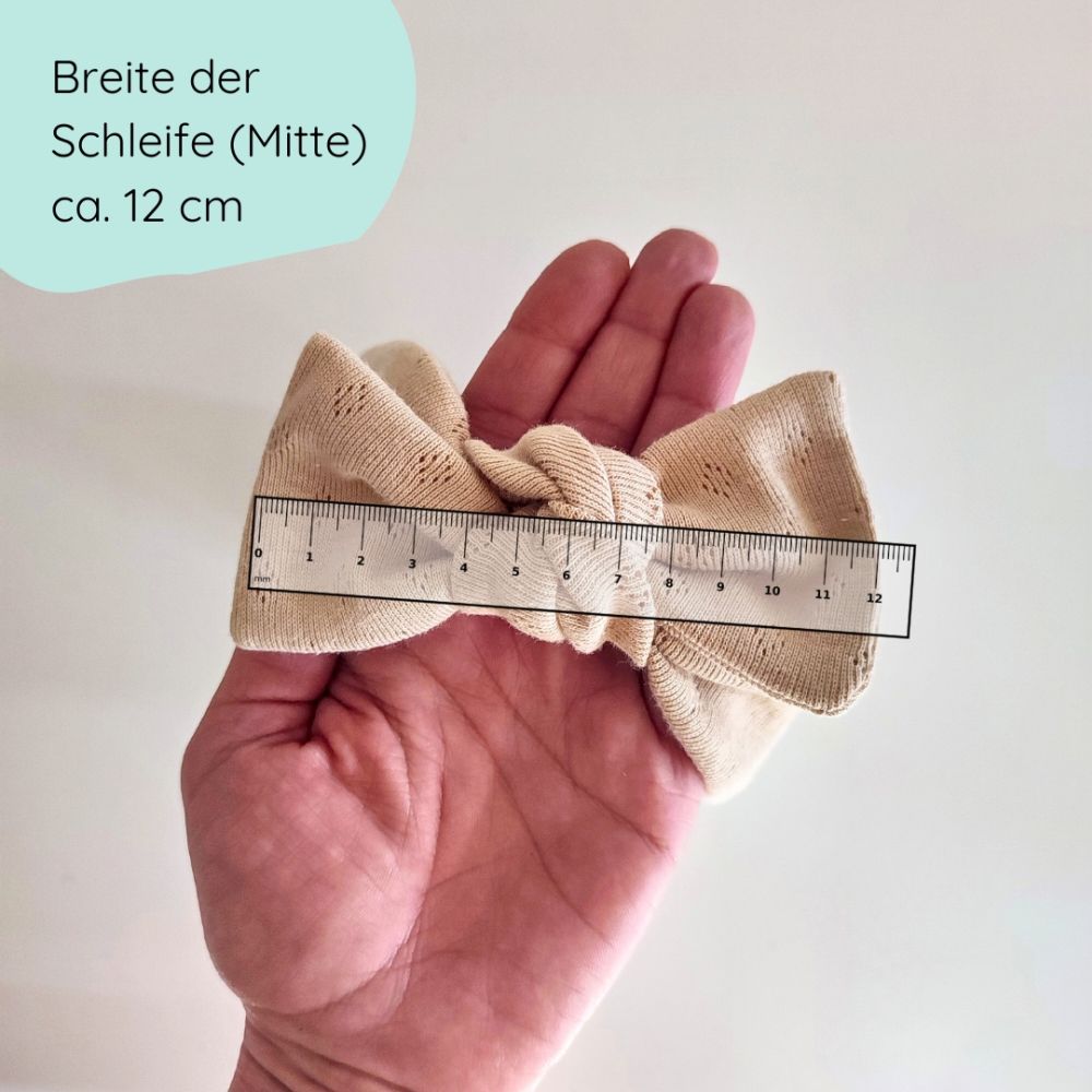 Detailbild Stirnband mit Schleife für Babys in beige