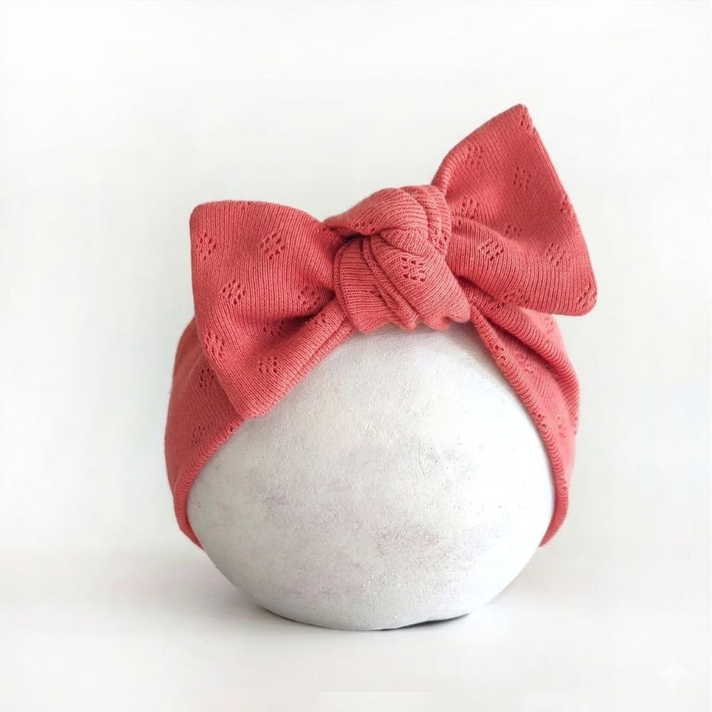 weiches Stirnband für Babys mit Schleife in koralle