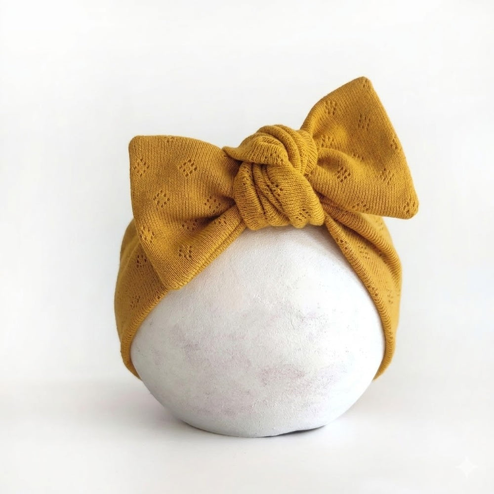 Stirnband mit Schleife für Babys in senfgelb