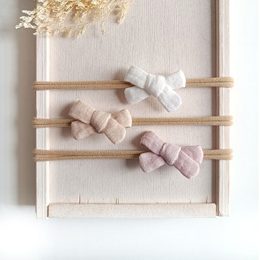Haarschleifenset für Babys in den Farben weiß, beige und hellrosa