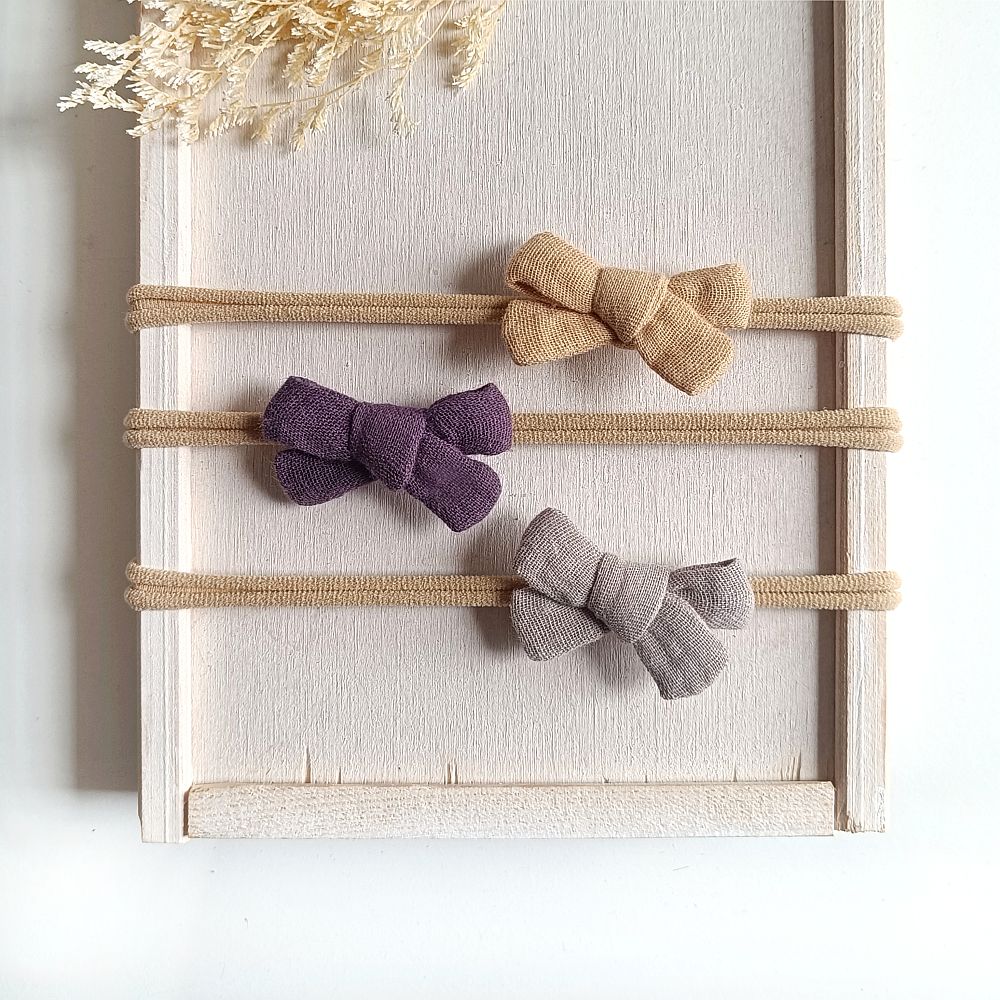 Haarschleifenset für Babys in den Farben sand, pflaume und taupe