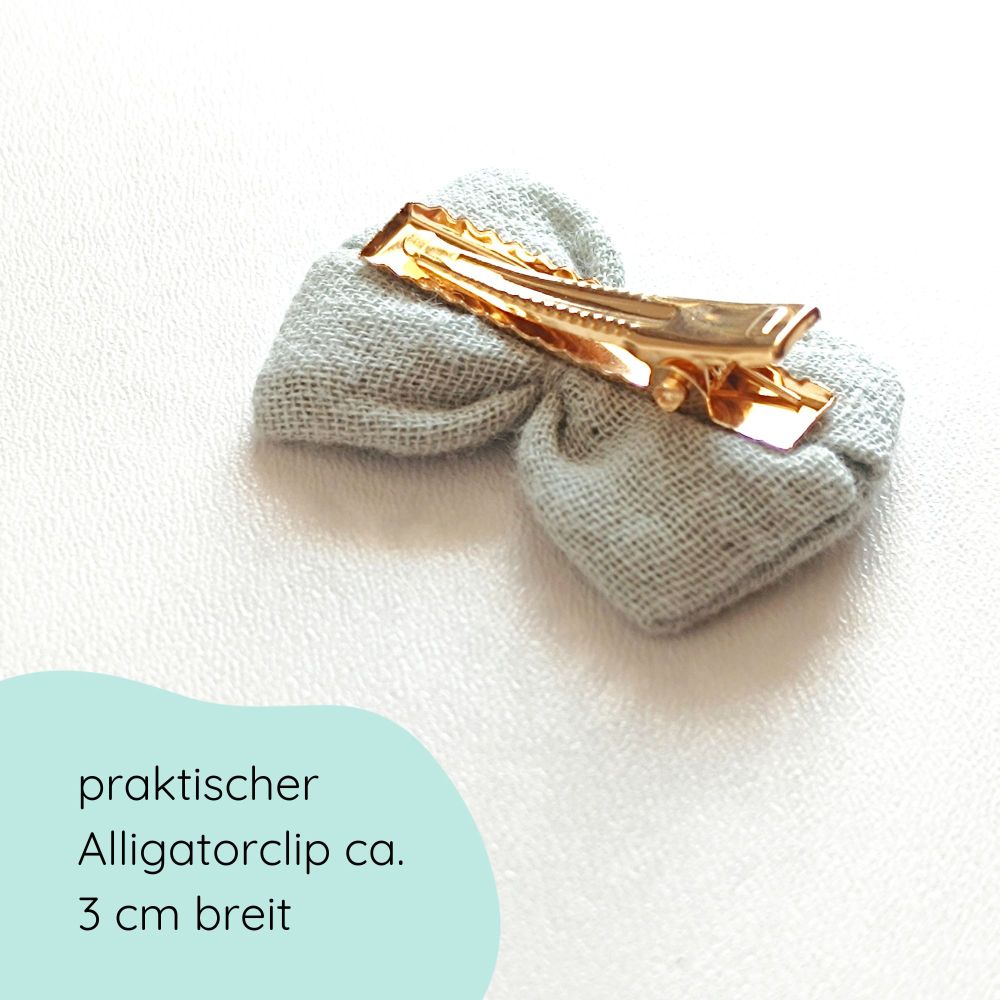 Detailbild kleine Haarschleife aus Musselin in mint an einem Alligartorclip