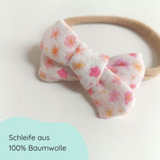 Detailbild kleine Haarschleife für Babys in weiß mit Blümchen