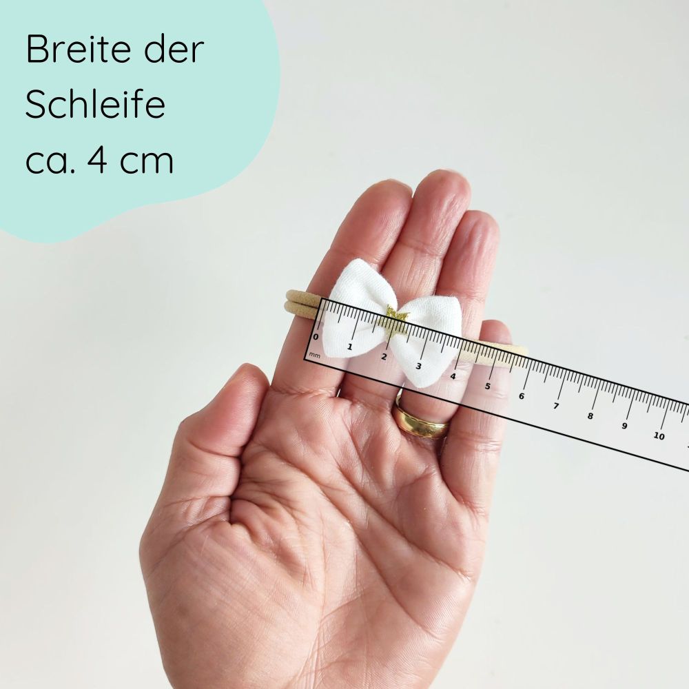 Haarschleife für Babys in weiß mit goldenem Stern Detailbild