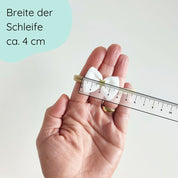 Haarschleife für Babys in weiß mit goldenem Stern Detailbild
