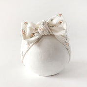 Stirnband für Babys mit Schleife in creme mit vintage Blumenmuster