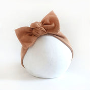 Stirnband für Babys mit Schleife in toffee